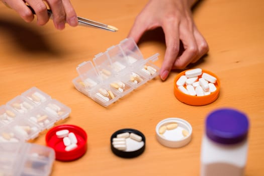 Put medicine on the medical pill box