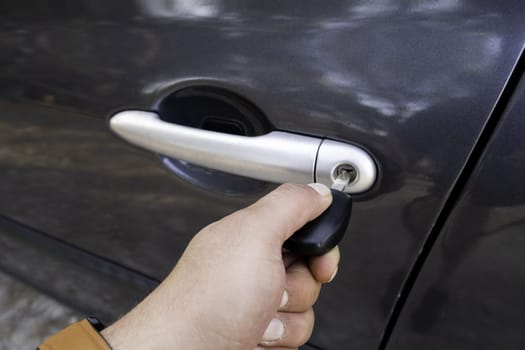 Detail of opening car door manually, key