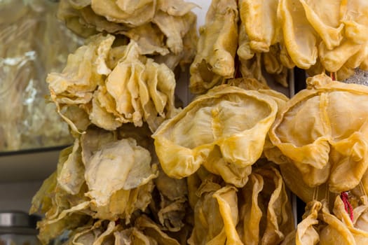 Dry fish maw hanging at the store for selling