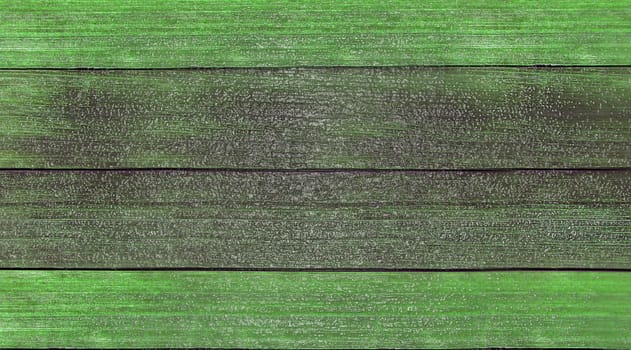 Wooden background. Old green painted wooden plank surface, aged weathered cracked boards. Grunge shabby texture, wallpaper, backdrop