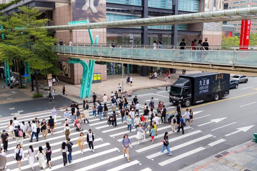 Taipei, Taiwan 02 October 2023: Top view of people cross the road in xinyi district