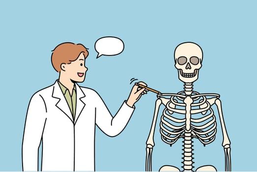 Man teacher at medical college, talks about structure of human skeleton, and teaches future doctors to treat people. Guy student at medical university, taking anatomy exam to gain access to patients.