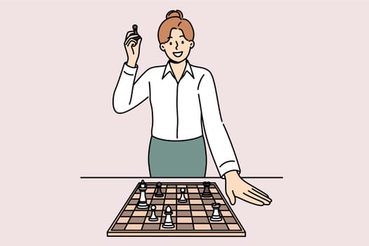 Business woman stands near chessboard, talking about importance of strategic planning and personnel skills. Chess pawn in hands of strategically thinking businesslady planning development of company