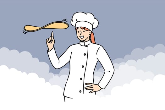 Woman chef cook prepares dough for pizza or delicious pie, stands among clouds of flour. Girl restaurant chef demonstrates skills in preparing complex dishes and baking with unique recipe.