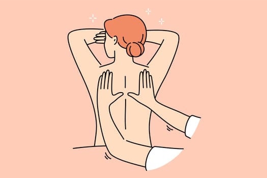 Woman attends massage treatments in SPA salon, lying with bare back and enjoying rejuvenation therapy. Hands of massage specialist kneading skin of relaxed girl, is tired after difficult work week
