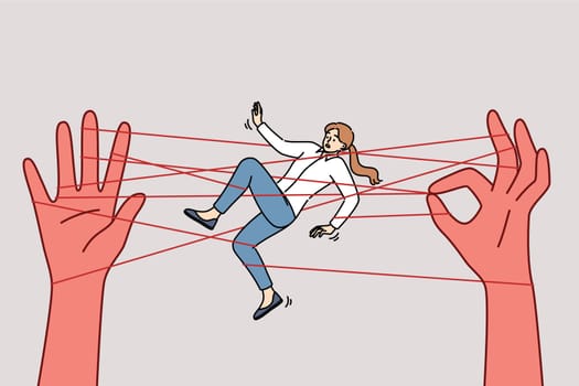 Business woman in manipulator networks with big hands, for concept unethical human resource management system company. Businesslady victim of manipulator needs help to get rid of career addiction