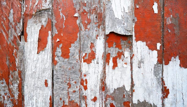 Light blue red and green weathered wooden background with cracked paint.