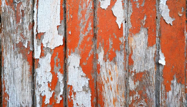 Light blue red and green weathered wooden background with cracked paint.