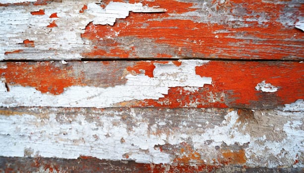 Light blue red and green weathered wooden background with cracked paint.
