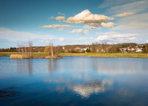 reflection on the small lake in village of Stoob, Burgenland