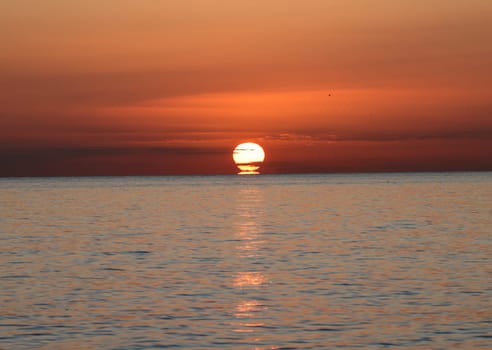 Sunrise over the Mediterranean Sea seen from the beach in Torremolinos. Costa del Sol, Spain