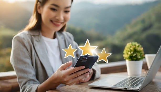 Close up of woman customer giving a five star rating on smartphone. Review, Service rating, satisfaction, Customer service experience and satisfaction survey concept