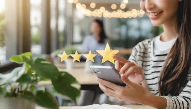 Close up of woman customer giving a five star rating on smartphone. Review, Service rating, satisfaction, Customer service experience and satisfaction survey concept
