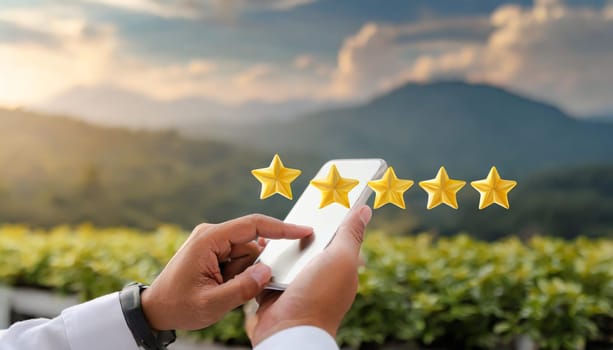 close up on customer man hand pressing on smartphone screen with gold five star rating feedback icon and press level three rank (good) for give score point to review the service business concept