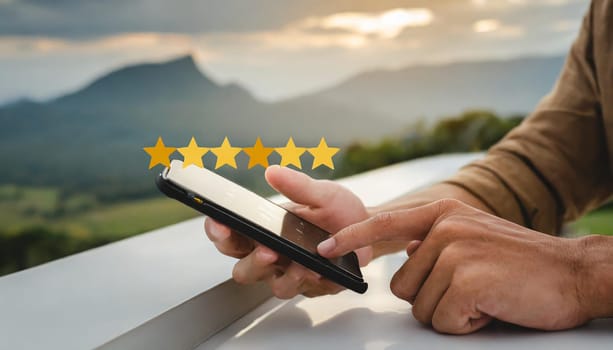 close up on customer man hand pressing on smartphone screen with gold five star rating feedback icon and press level three rank (good) for give score point to review the service business concept