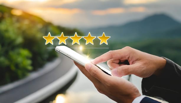 close up on customer man hand pressing on smartphone screen with gold five star rating feedback icon and press level three rank (good) for give score point to review the service business concept