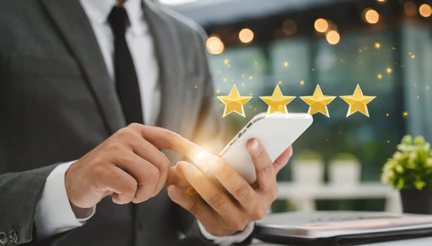 close up on customer man hand pressing on smartphone screen with gold five star rating feedback icon and press level three rank (good) for give score point to review the service business concept