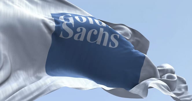 New York, US, Mar. 2 2024: Goldman Sachs bank flag waving on a clear day. Illustrative editorial 3d illustration. Finance and banking. Selective focus