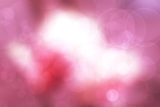 A festive abstract gradient orange pink white background texture with glitter defocused sparkle bokeh circles . Card concept for Happy New Year, party invitation, valentine or other holidays.