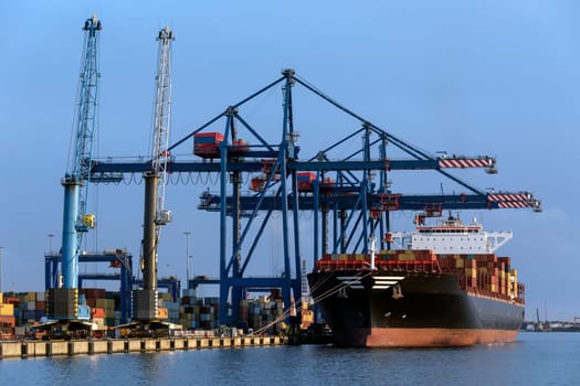A large container ship unloading in the port of Klaipeda in Lithuania.