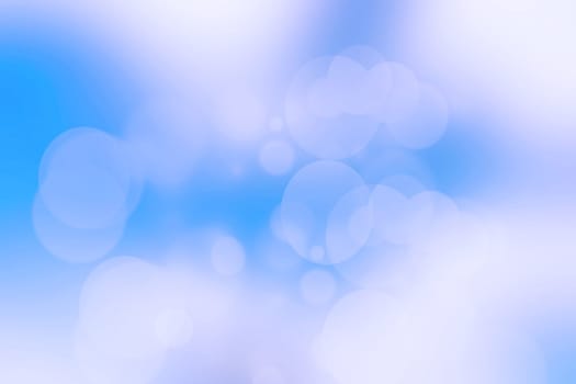 Abstract bright gradient motion spring or summer landscape texture with natural blue lights and white bright cloudy and sunny sky. Beautiful delicate Autumn or summer background with copy space.