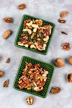 Mix of various nuts, pistachios, cashews, walnuts, peanuts and brazil nuts. Top view.