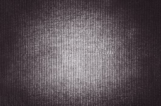 A brown image of convex vertical stripes with an illuminated center and a shadow at the edges
