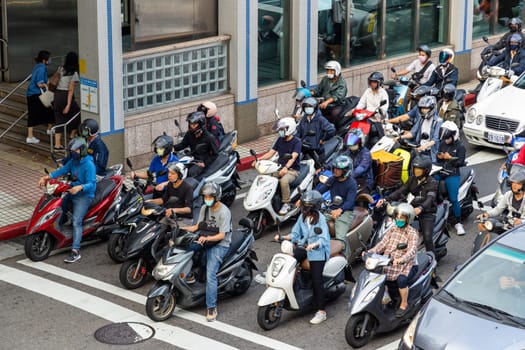 Taipei, Taiwan 25 May 2023: Motor bike on the street wait for traffic light in Taipei city