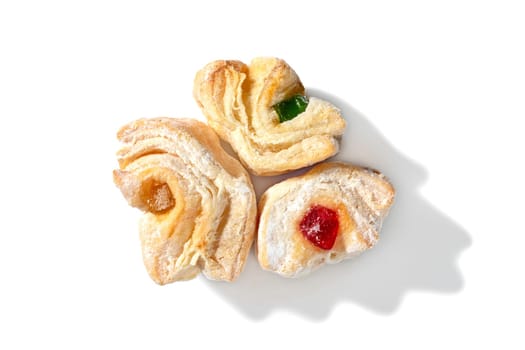 Indulge in a trio of delightful treats! Flaky puff pastry envelopes vibrant red Turkish Delight, dusted with a delicate veil of powdered sugar. Perfect for sharing or savoring one at a time.