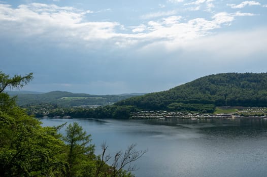 View of the Lake Eder with a campsite, sky and clouds, Hesse, Germany
