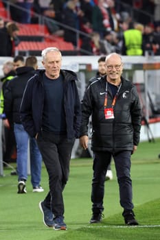 Coach Christian Streich (SC Freiburg) on his way to a TV interview ahead of the Europa League match - Round of 16: SC Freiburg vs West Ham United