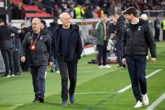 Coach Christian Streich (SC Freiburg) on his way to a TV interview ahead of the Europa League match - Round of 16: SC Freiburg vs West Ham United