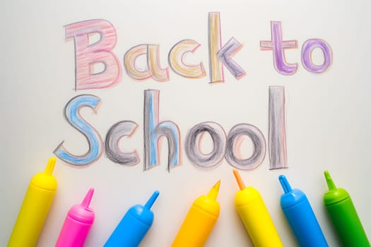 Naive children's drawing with colored chalk on white paper, made by hand by a child, text Back to School. Neural network generated image. Not based on any actual scene or pattern.