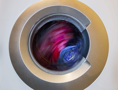 a close view of domestic washing machine at work.
