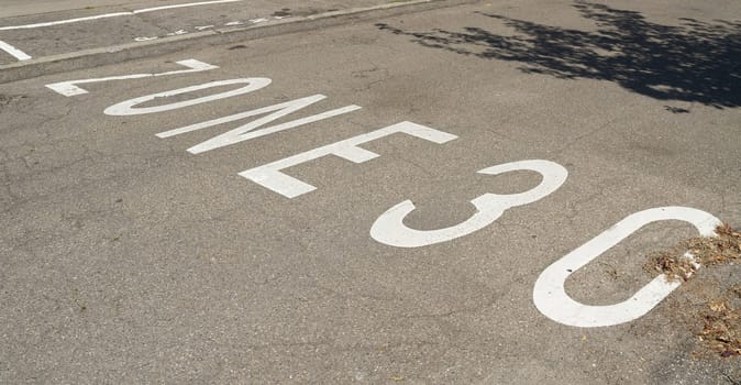 Road markings indicating a zone 30 speed limit in the city center of Colmar in France