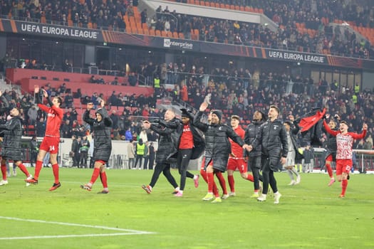 After the final whistle,the Freiburg players celebrate the 1-0 victory with their own fans in the match of the Football Europa League - Round of 16: SC Freiburg vs West Ham United