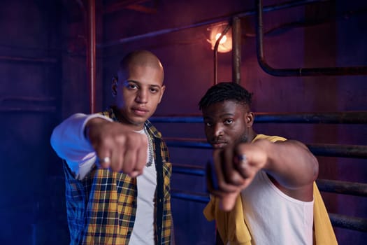 Young confident junior gang members giving fist welcoming each other. Dangerous criminal society concept