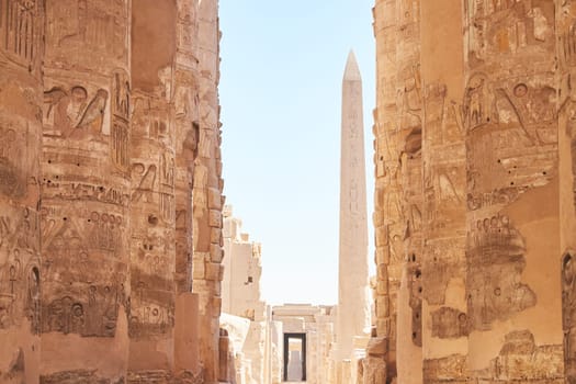 Karnak temples complex in Luxor - ancient Thebes. Pillars with Egyptian hieroglyphs. Popular Egyptian landmark. Ancient Egypt. Vacation destination. Historic site. Travel attractions and heritage in Egypt