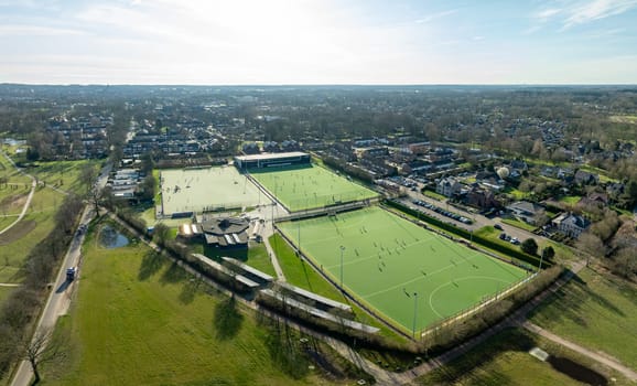 aerial shot of a sports field with people playing on it