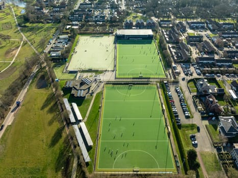 aerial shot of a sports field with people playing on it