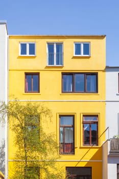Old, yellow residential building, rear view with windows, Bremen, Germany