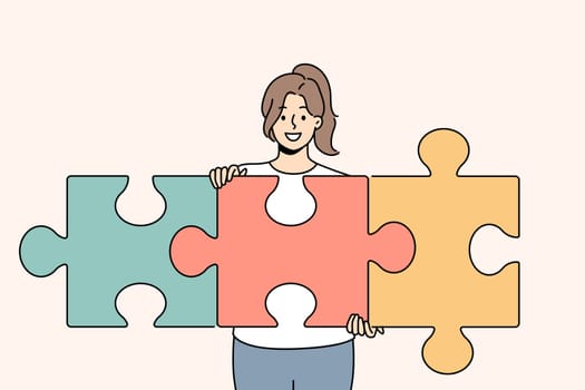 Successful woman unraveling puzzle and solving complex task while developing own startup