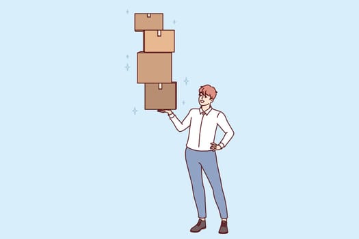 Successful man lifts several cardboard boxes with ease, demonstrating professional skills in fulfillment of goods. Businessman engaged in logistics or storage services and owns fulfillment company