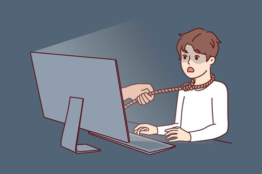 Boy suffering from addiction or hate from online friends sits at table with computer with rope around neck. Unfortunate child fell into trap of online moniker or pedophile who wants to kidnap teenager