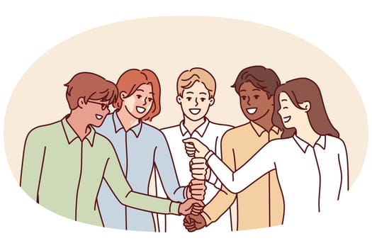 Happy diverse business team of employees celebrating success by touching with fists in center and enjoying working together. Positive people cooperate together to achieve best results and meet KPIs