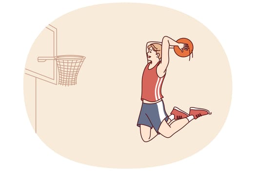 Professional basketball player bounces with ball in hands to score goal in hoop and defeat opposing team. Man basketball player trains wanting to become champion and participate in competitions