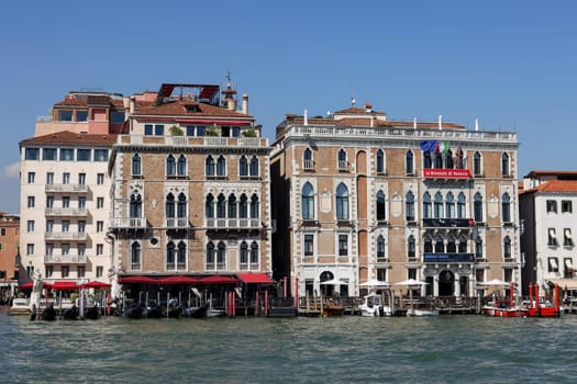 Venice, Italy - Sept 6, 2022: The Bauer Palazzo a historic five-star hotel and the Ca' Giustinian on the Grand Canal in the San Marco sestiere of Venice. It is today the seat of the Venice Biennale.