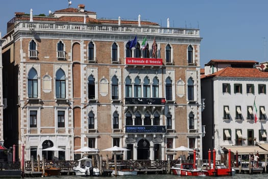Venice, Italy - Sept 5, 2022: The Ca' Giustinian, sometimes called the Palazzo Giustinian on the Grand Canal in the San Marco sestiere of Venice. It is today the seat of the Venice Biennale.
