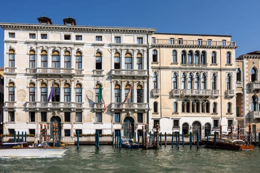 Venice, Italy - September 6, 2022: Houses and palaces seen from a motorboat cruise along the Grand Canal in Venice