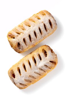 Behold the harmonious duo of apple strudels, an epitome of homemade sweetness on white. With a golden crust and luscious apple filling, they beckon with the promise of delectable delight.